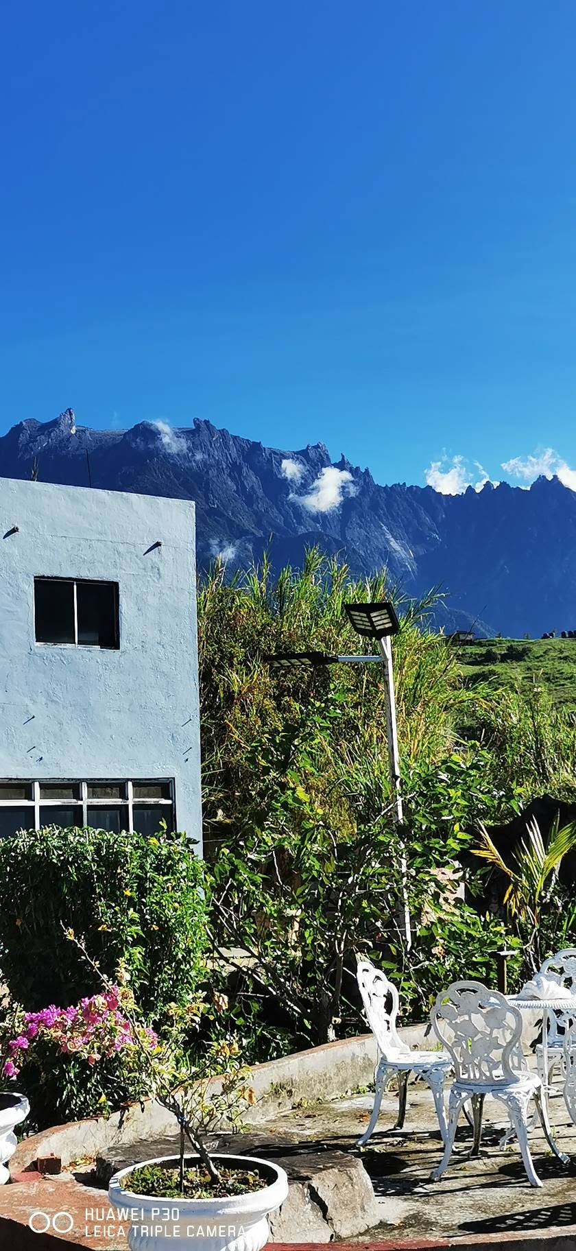 Mount Kinabalu rising behind RizQ Resort's garden terrace
